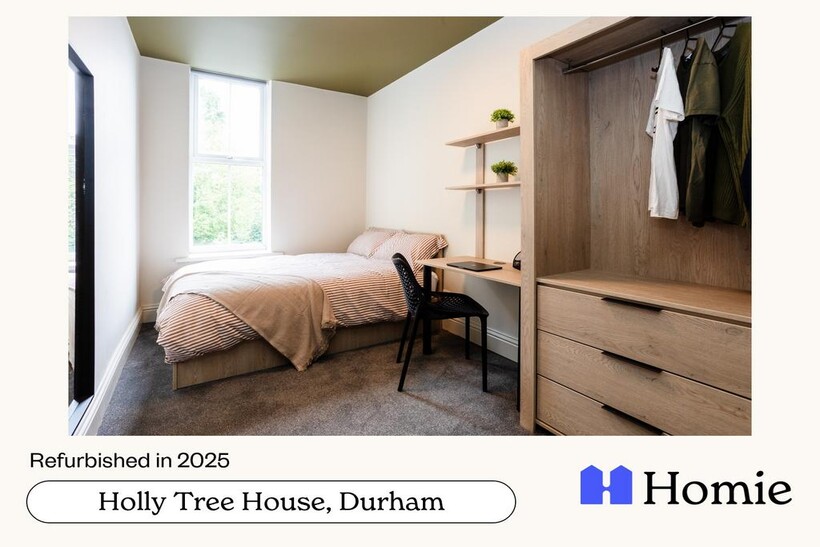 A bright and tidy master bedroom featuring a co...