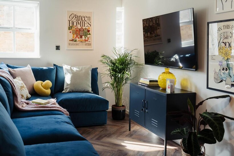 A stylish, well-lit living room featuring a com...