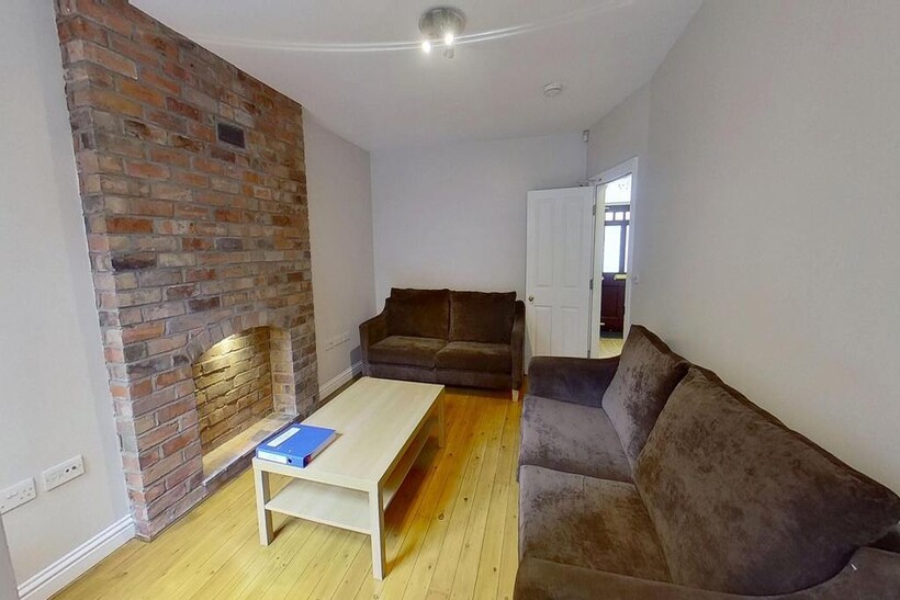 A spacious, well-lit contemporary living room f...