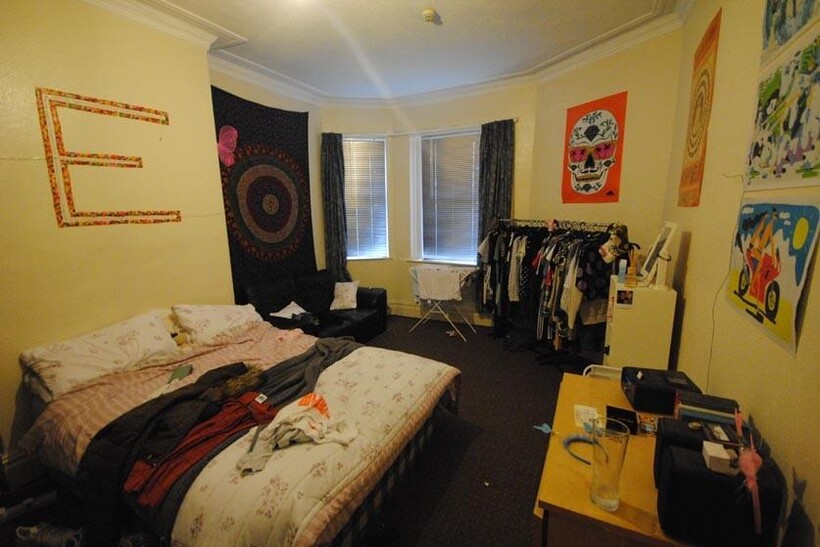 A spacious & cozy master bedroom featuring a la...