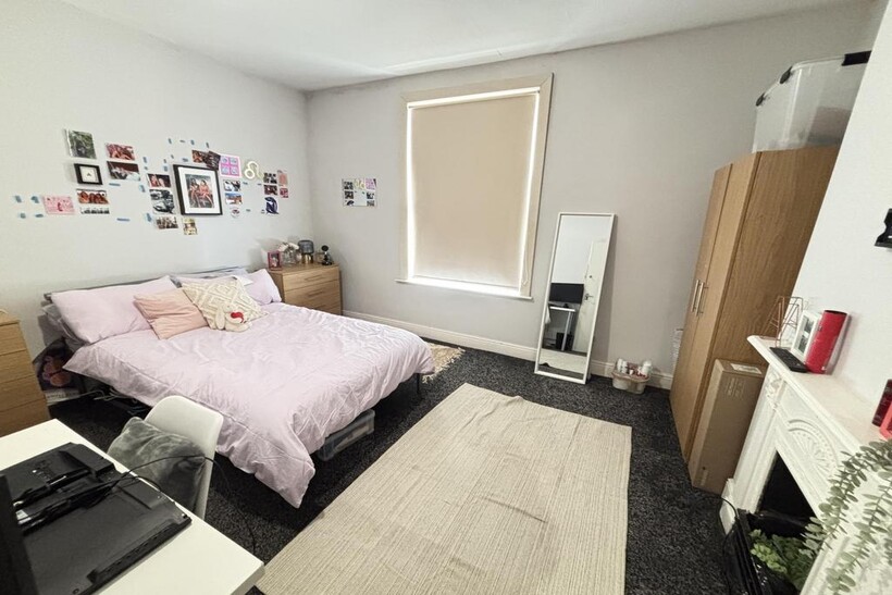 A bright and spacious master bedroom featuring ...