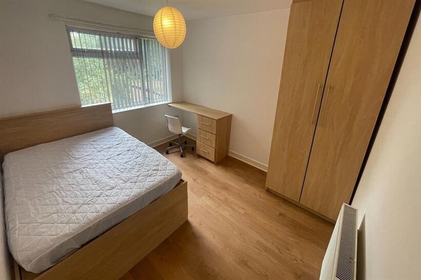 A spacious and well-maintained master bedroom f...