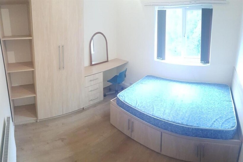 A bright and spacious master bedroom featuring ...