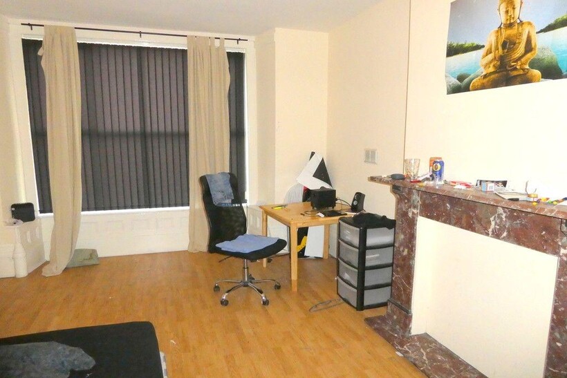 A bright and inviting living room featuring a c...