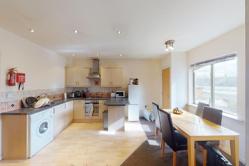 A bright and spacious living room featuring mod...