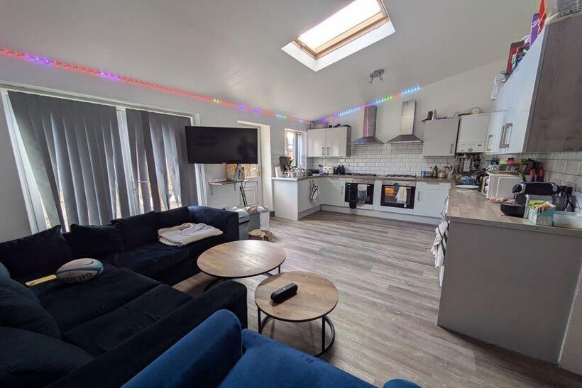 A bright and welcoming living room with modern ...