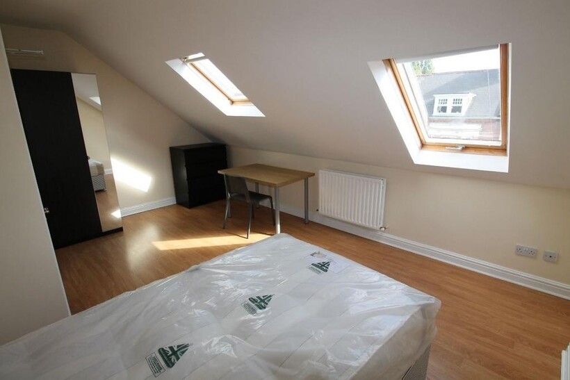 Bright and airy bedroom featuring two spacious ...