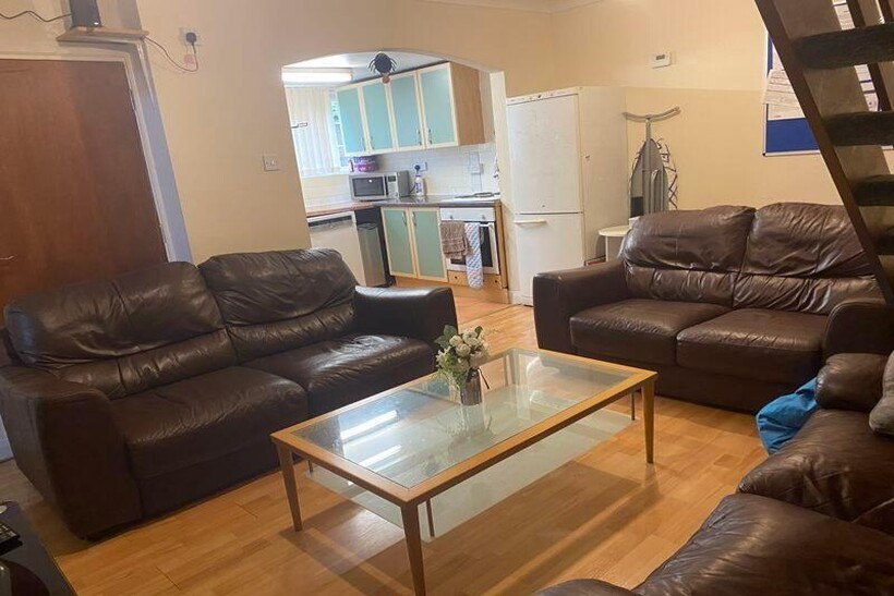 A spacious and well-maintained living room with...