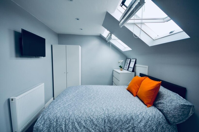 Bright and spacious master bedroom featuring a ...