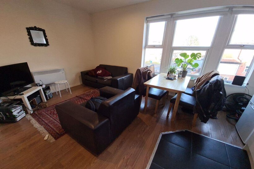 A bright and inviting living room with large wi...