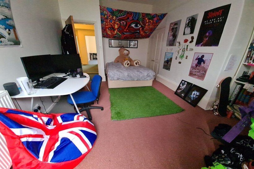 A spacious and inviting master bedroom featurin...