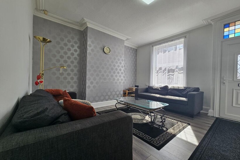 A spacious and well-maintained living room with...