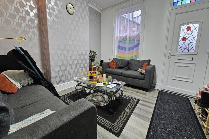 Modern and well-lit living room featuring comfo...