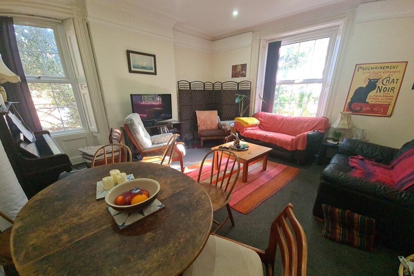 A cozy and inviting living room featuring comfo...