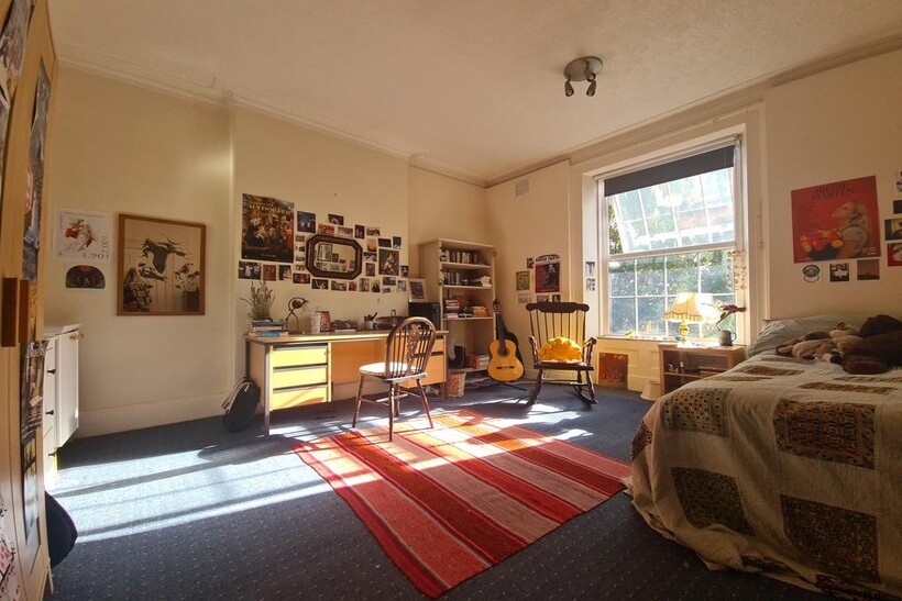 Bright and welcoming living room filled with na...