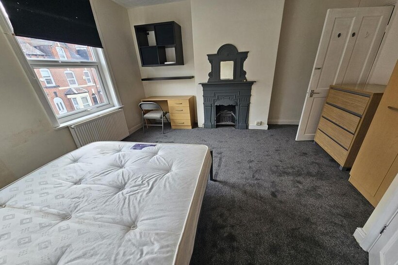 A bright and welcoming living room featuring a ...