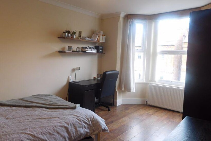 A bright and inviting living room with large wi...