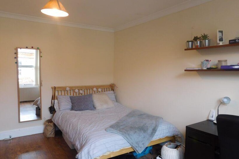 A comfortable and well-maintained bedroom featu...