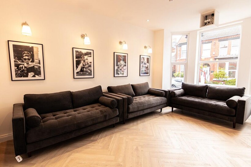 A spacious and stylish living room featuring co...