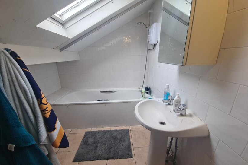 A clean, well-maintained bathroom featuring a b...