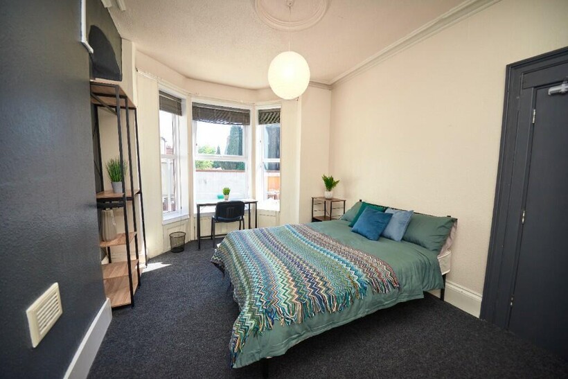 Bright and inviting double bedroom featuring a ...