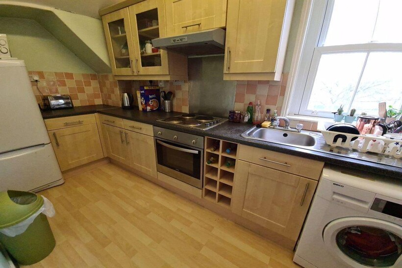 Bright and functional kitchen with ample natura...