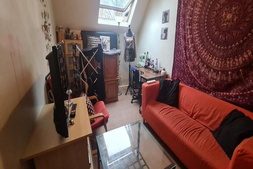 A cozy living room featuring a comfortable sofa...