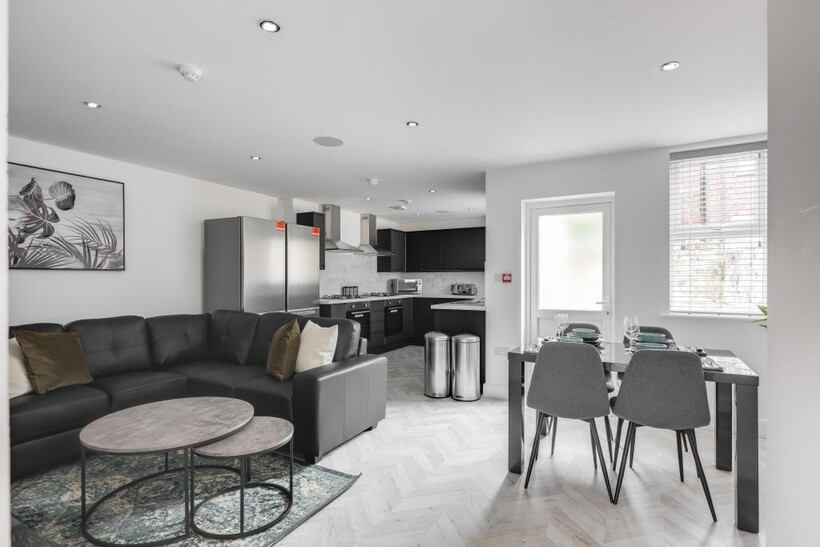 A bright, modern living room with ample natural...