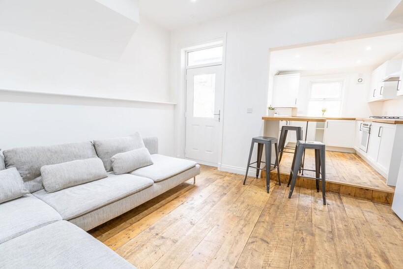 Bright and airy living space featuring a comfor...