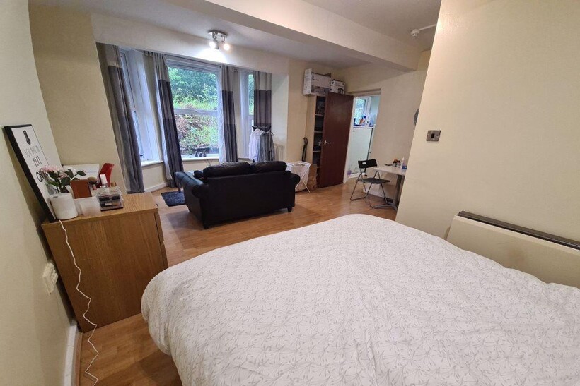 A spacious and well-maintained master bedroom f...