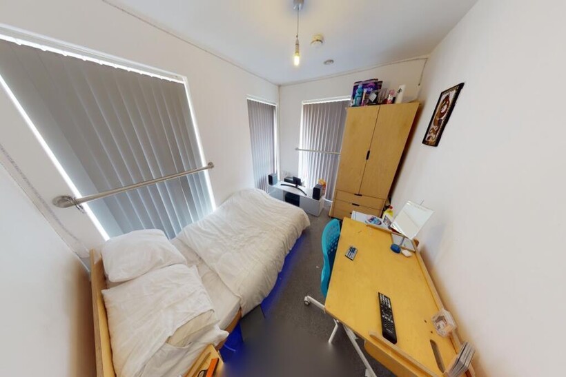 A bright and inviting living room featuring lar...