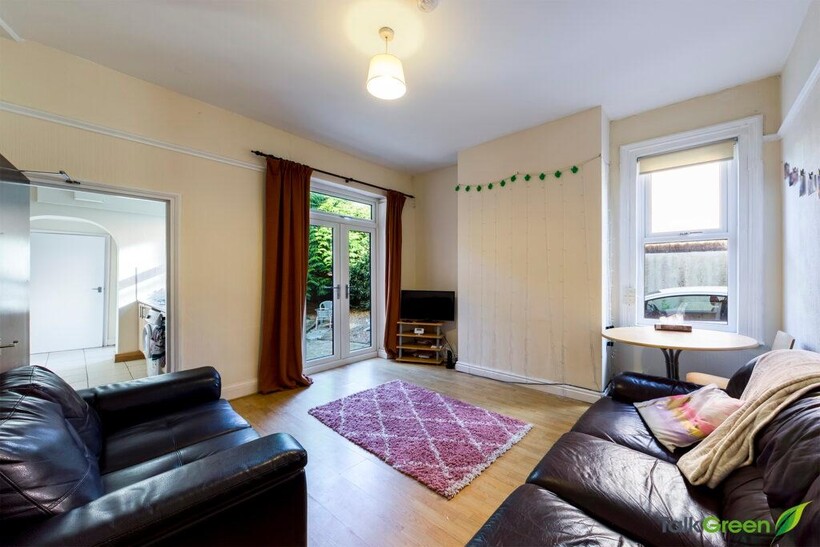 Bright and welcoming living room featuring larg...