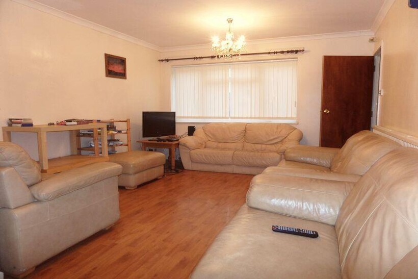 A spacious and inviting living room featuring c...