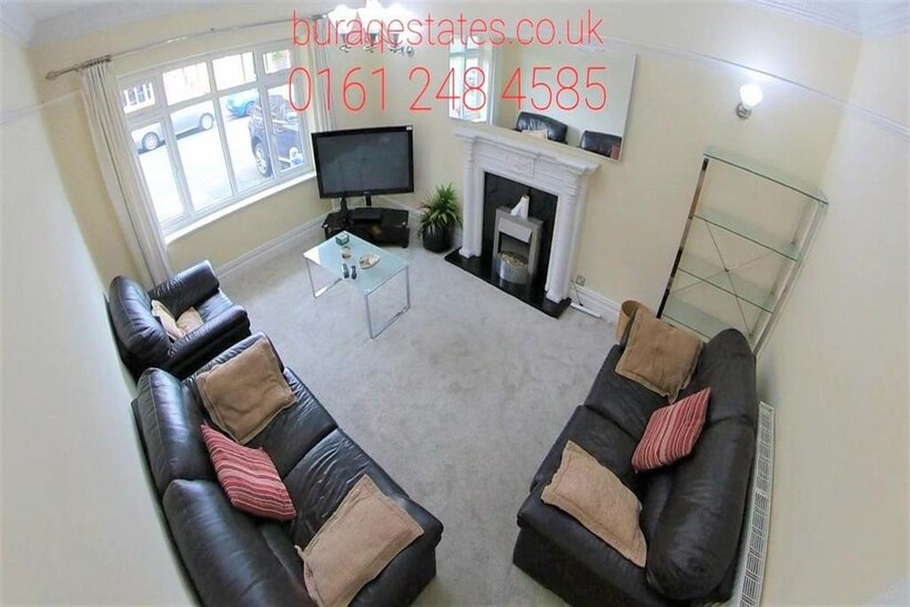 A spacious and well-maintained living room feat...