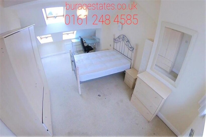 A bright and tidy single bedroom featuring a be...