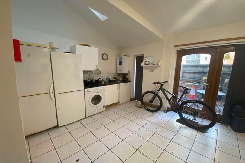 A bright and functional kitchenette with ample ...