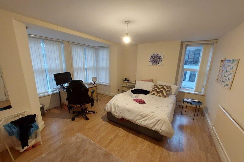 A spacious and welcoming living room featuring ...