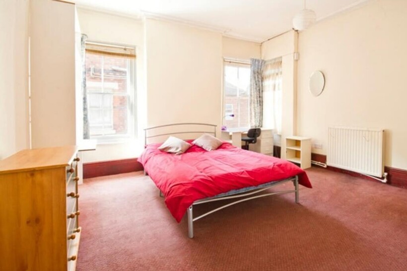 A spacious and inviting double bedroom, perfect...