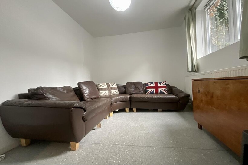 A bright and welcoming living room featuring a ...