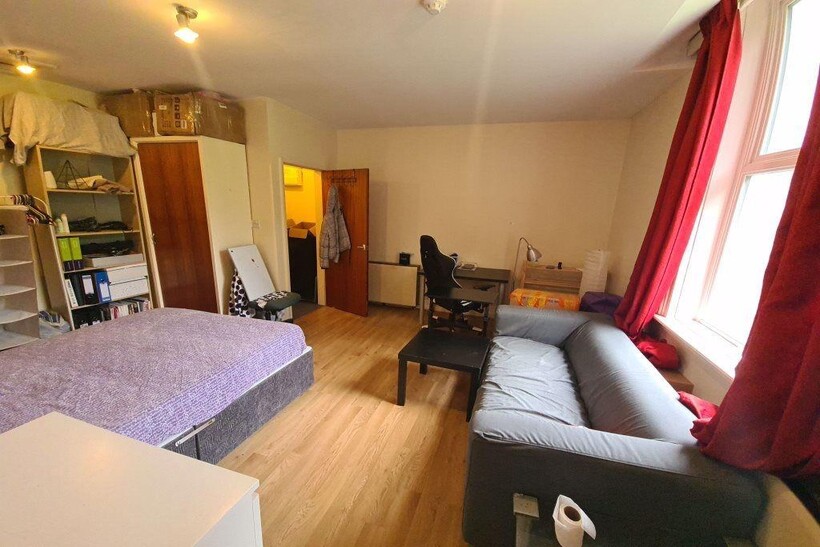 Bright, well-kept bedroom with a double bed, so...