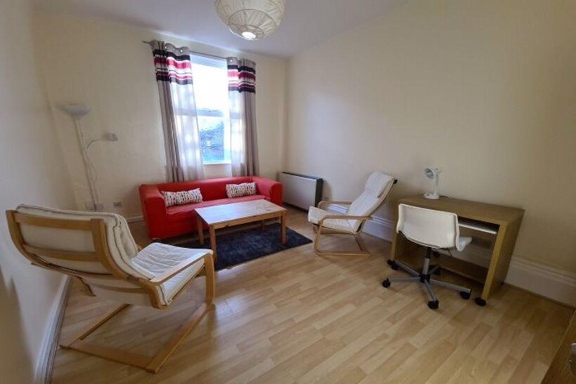 Bright, neatly furnished living room with light...