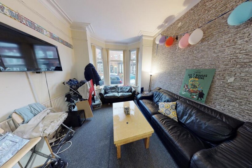 Bright and inviting living room featuring large...