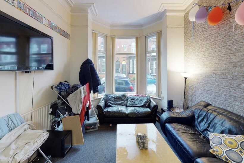 A bright and cozy living room with natural ligh...