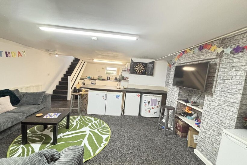 A spacious and welcoming living room featuring ...