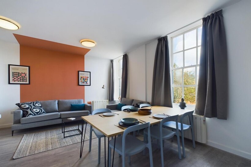 A spacious and stylish modern living room, perf...