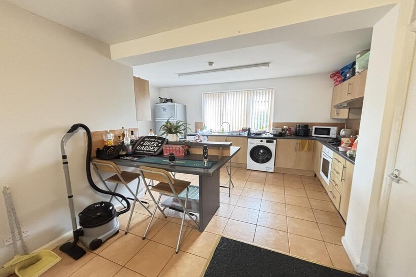 A bright and functional kitchen with ample natu...