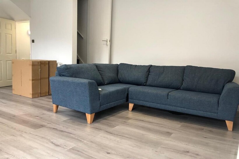 A spacious and modern living room featuring a l...