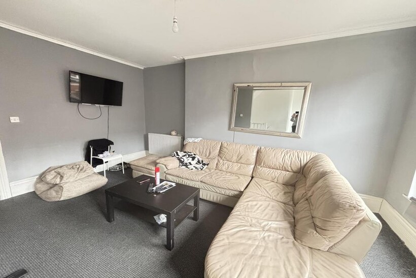 A bright and spacious modern living room with a...