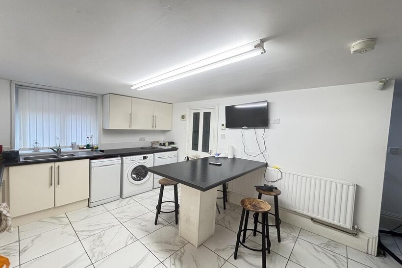 Bright and functional kitchen space featuring a...