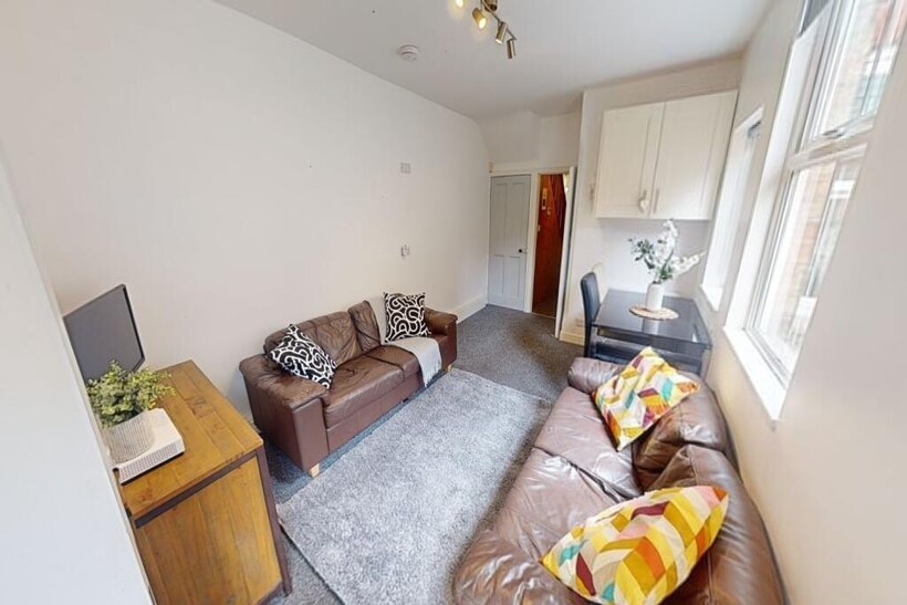 Spacious and bright living room featuring comfo...